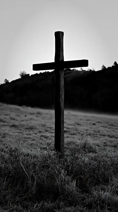 Carved oak cross in frosted meadow at dawn - AI-generated stock image